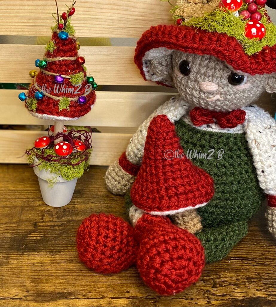 a mushroom christmas tree, a woodland mushroom elf and a crocheted mushroom