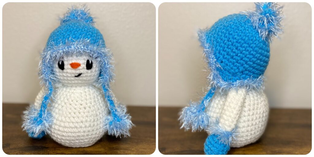 a snowman with blue mittens and hat