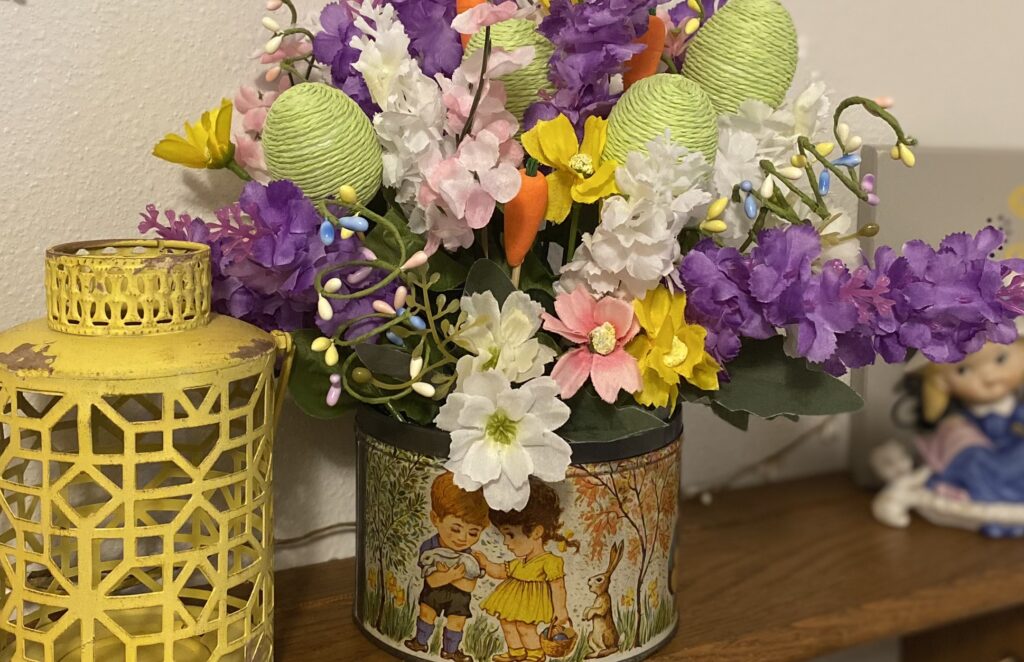 vintage candy tin repurposed into an Easter arrangement